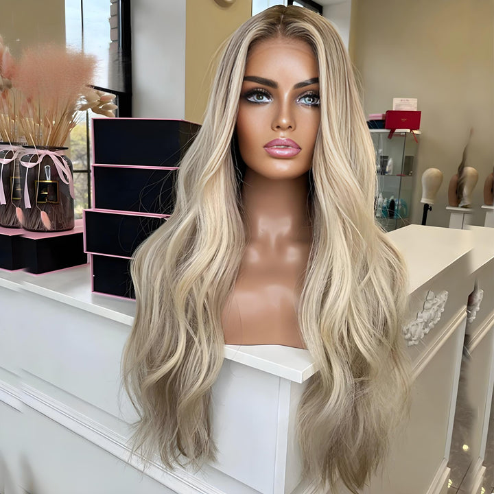 360 HD lace body wave wig in blonde brown color shown on mannequin with natural part and long waves.