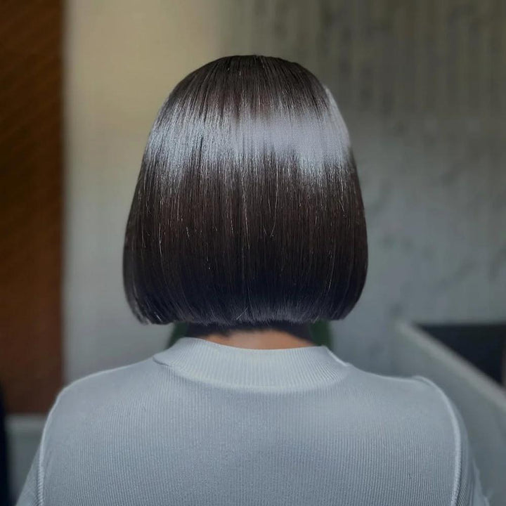 Back view of 2×6 Bob lace closure wig in natural color showing precise blunt cut and smooth straight texture.