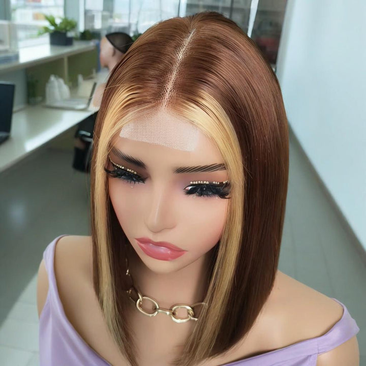 Close-up view from top of 2×6 Bob straight lace closure wig showing natural lace parting and medium brown base with auburn highlights.