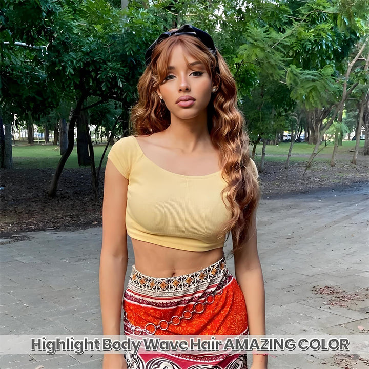 Outdoor model showcase of 2×6 body wave lace closure in medium brown with honey blonde highlights, showing full length and vibrant color.