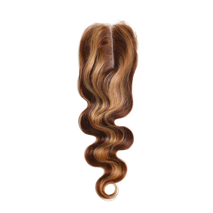 Top middle part view of 2×6 body wave lace closure in medium brown with honey blonde highlights, showing natural parting space.