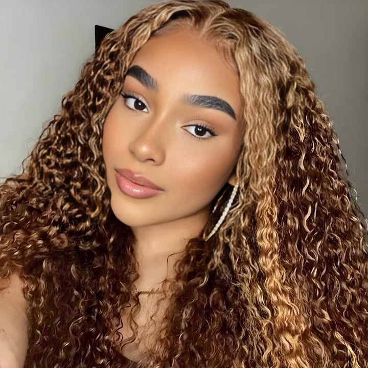 Model wearing deep wave hairstyle with 2×6 lace closure in medium brown and honey blonde highlights, showing natural blend and volume.