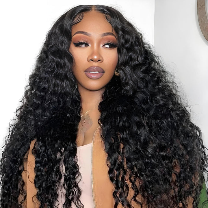 Model wearing natural color 2×6 deep wave lace closure with defined curly hairstyle and sleek edges.