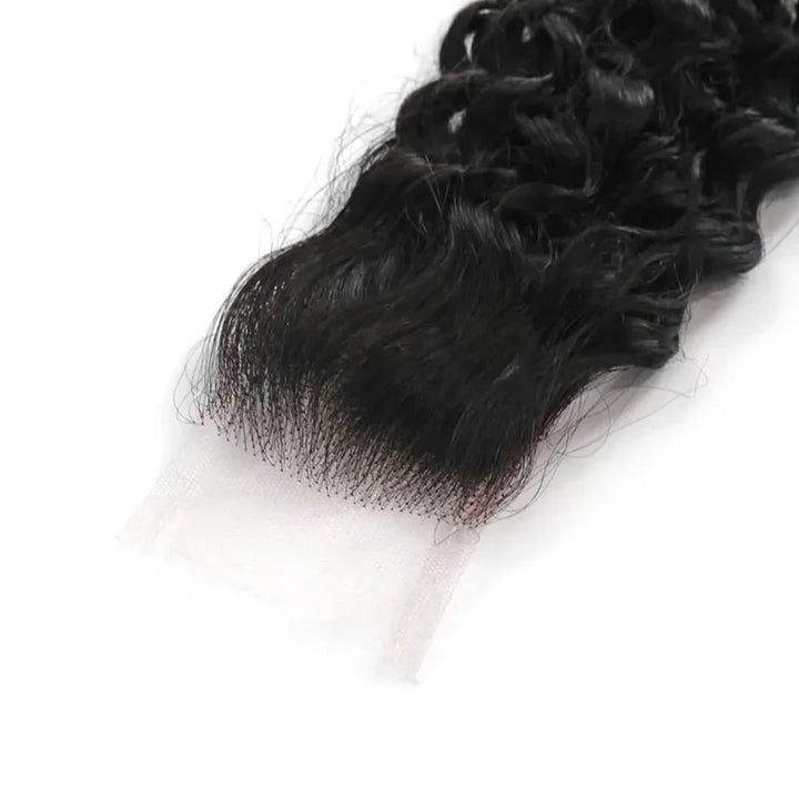 Close-up of natural color 2×6 kinky curly lace closure showing transparent lace front and pre-plucked natural hairline.