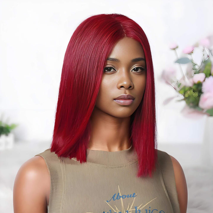 Angled front view of a straight reddish burgundy bob wig with lace parting, styled on a female model.
