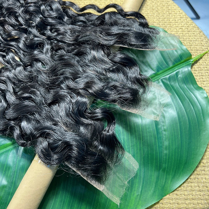 Close-up of lace edge on 2×6 water wave lace closure in natural color, highlighting transparent lace front.