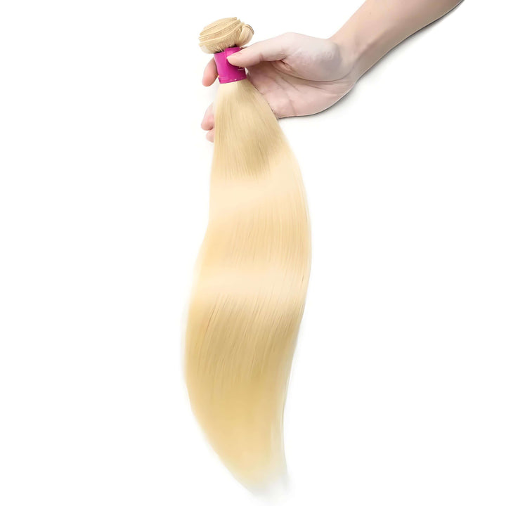 Single bundle of 613 blonde straight human hair held in hand, silky and smooth with natural shine.