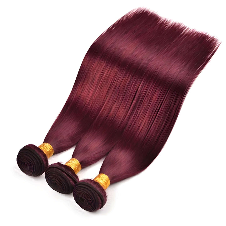 99J burgundy straight hair bundles laid flat, silky wine red strands with natural shine.