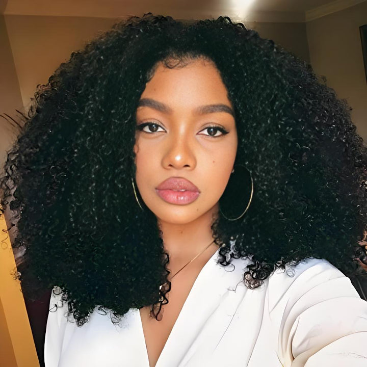 Model wearing EuxmeHair Afro Curly hair styled naturally with large, voluminous curls.