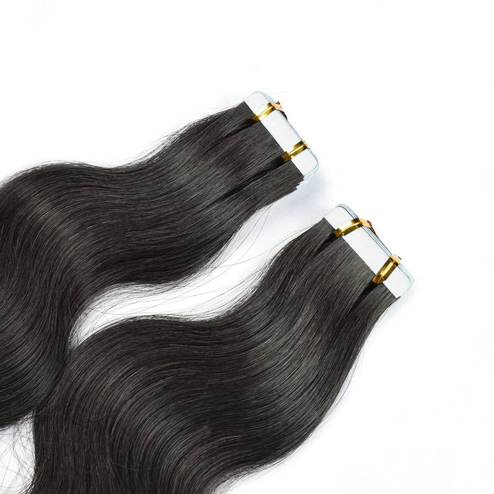 Model wearing body wave tape-in extensions in natural color, styled for a seamless blend.