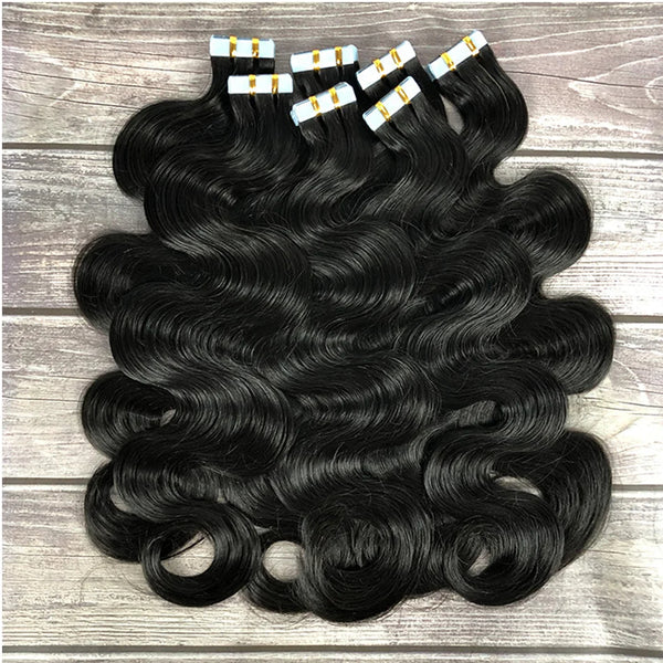 Top view of body wave tape-in hair in natural color, showing smooth waves and seamless texture.