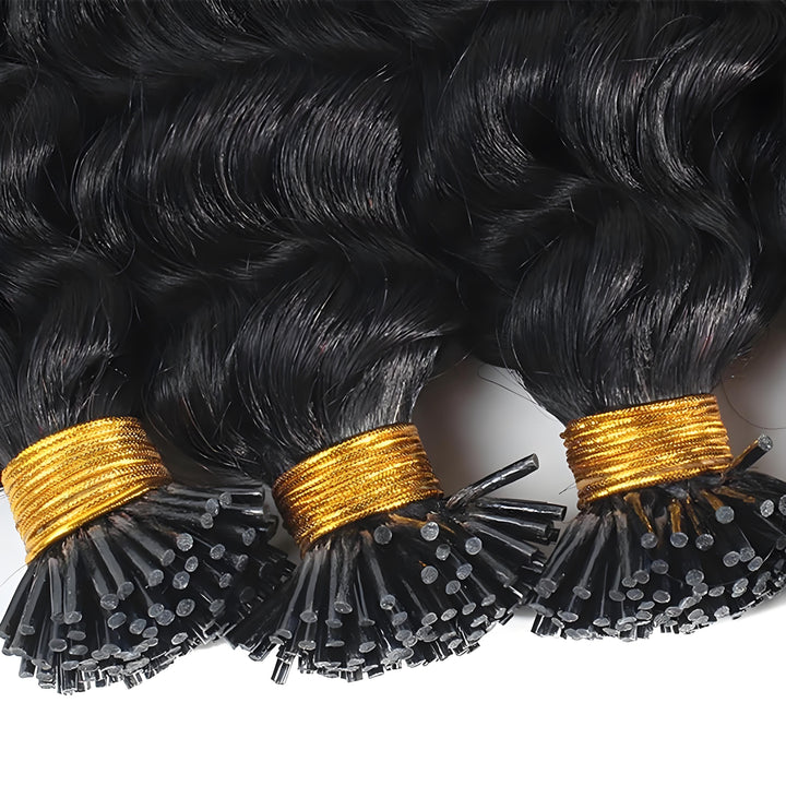 Two bundles of deep wave I-tip hair from EuxmeHair shown in hand, highlighting soft bounce and curl depth.