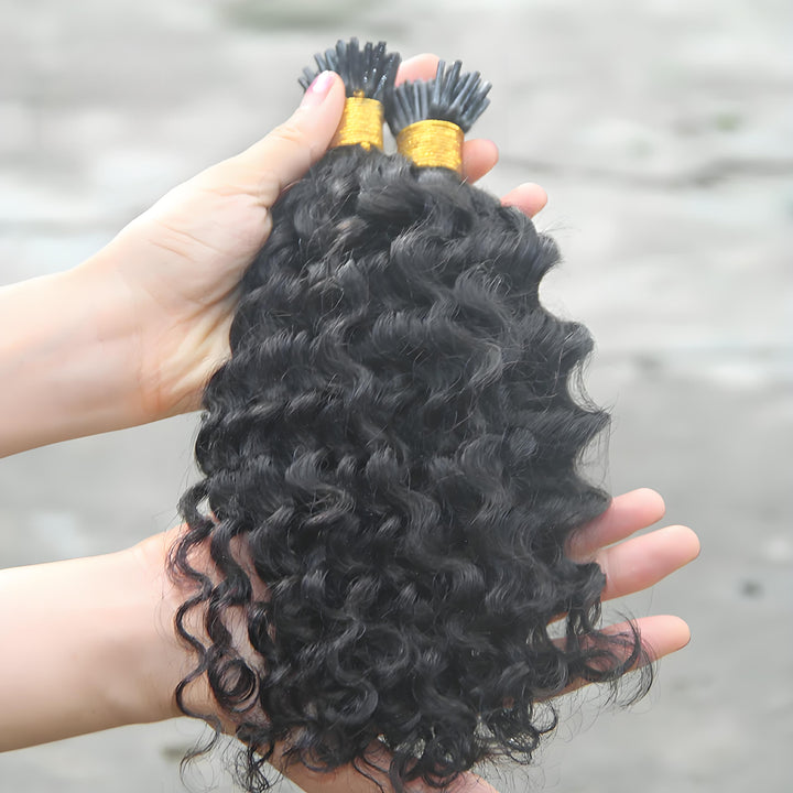 Top view of EuxmeHair deep wave I-tip extensions showcasing silky waves and uniform curl pattern.