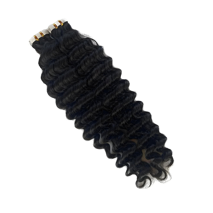 Single bundle of deep wave tape-in extensions on white background, showing consistent curl definition and sealed tape tabs.