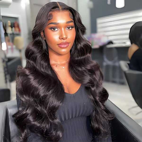 Close-up view of lace cap construction on natural color full lace body wave wig, showing stitching and ventilation details.