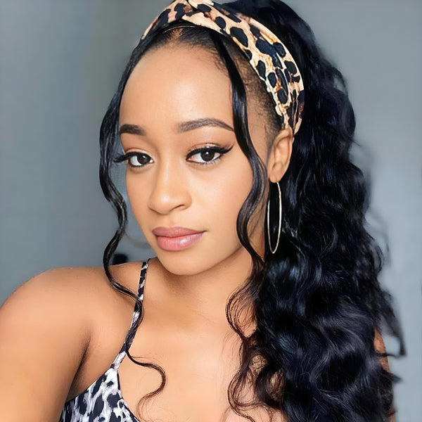 Close-up of model wearing Body Wave headband wig in natural color, styled with a leopard print band.