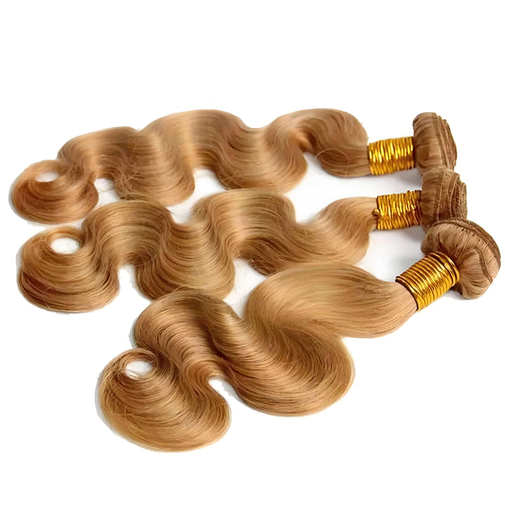 Close-up top view of honey blonde body wave hair bundles, highlighting reinforced double weft and soft silky waves.