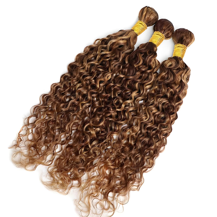 Three honey blonde highlight deep wave bundles laid flat to showcase luster and curl consistency.