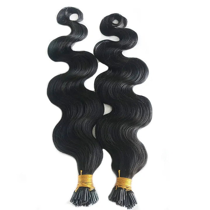 Two strands of EuxmeHair I-tip body wave extensions laid side by side, highlighting the wavy texture.