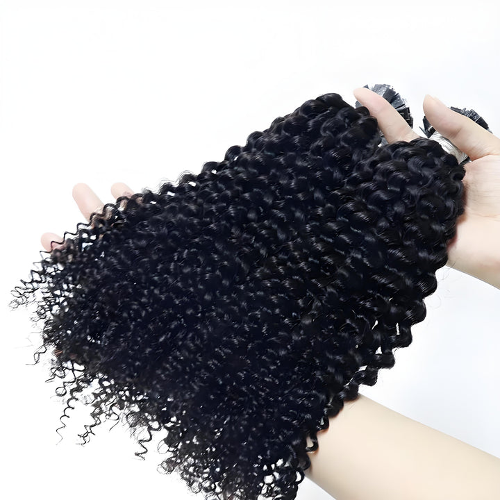 Close-up of EuxmeHair I Tip Kinky Curly bundle held in hand, showing dense root to tip fullness and defined curl texture.