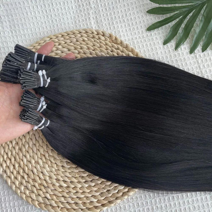 Natural Color I Tip Straight Hair Extensions held in hand, highlighting shine and cuticle alignment.