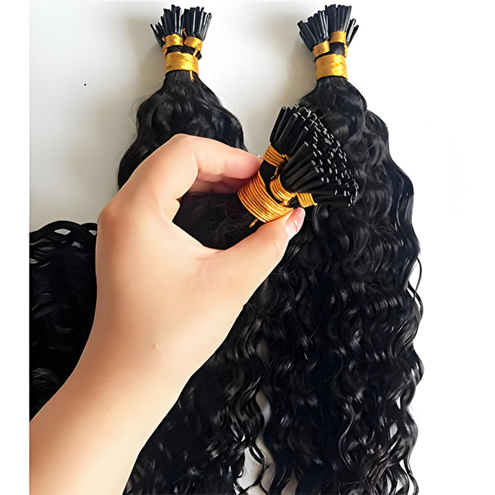 Hand holding bundle tip of EuxmeHair I Tip Water Wave Hair—clearly showing tight keratin bonds and soft spiral curl pattern.