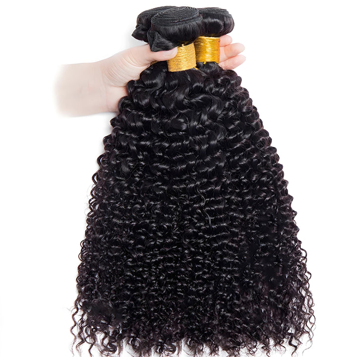 Hand holding three EuxmeHair kinky curly hair bundles with tight curls and healthy ends.
