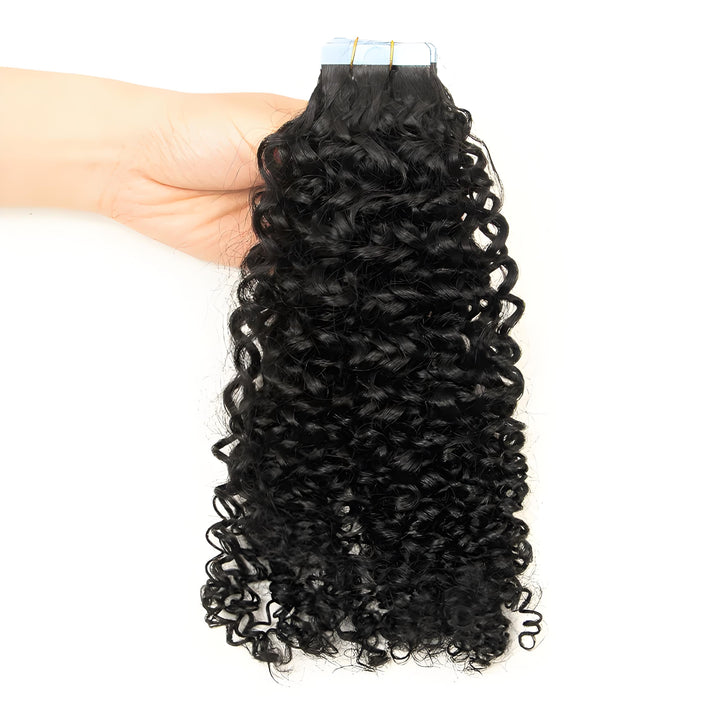 Model wearing natural color kinky curly tape-in hair extensions, showcasing full volume and bouncy curls.