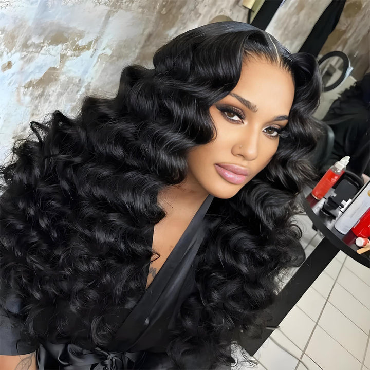 Close-up of defined loose waves on HD lace wig styled in glamorous finish.