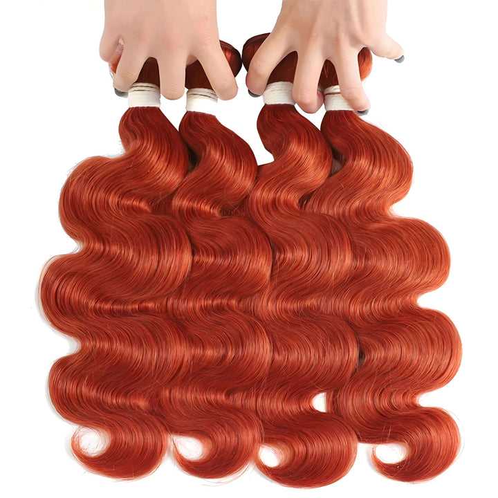 Four bundles of orange body wave human hair held by hands, silky vibrant waves with natural shine.