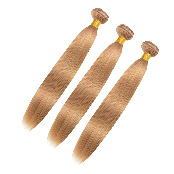 Set of three straight honey blonde #27 bundles tied with golden band, smooth and thick from top to end.