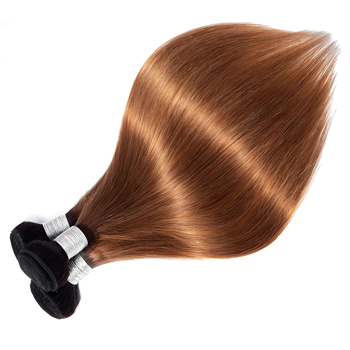 Close-up of straight bundles in T1B/30 ombre, highlighting silky smooth texture and natural auburn shine.