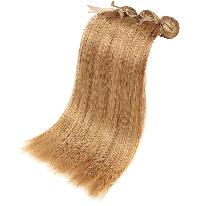 Close-up of silky straight honey blonde #27 hair bundles tied with ribbon, showing smooth texture and shine.