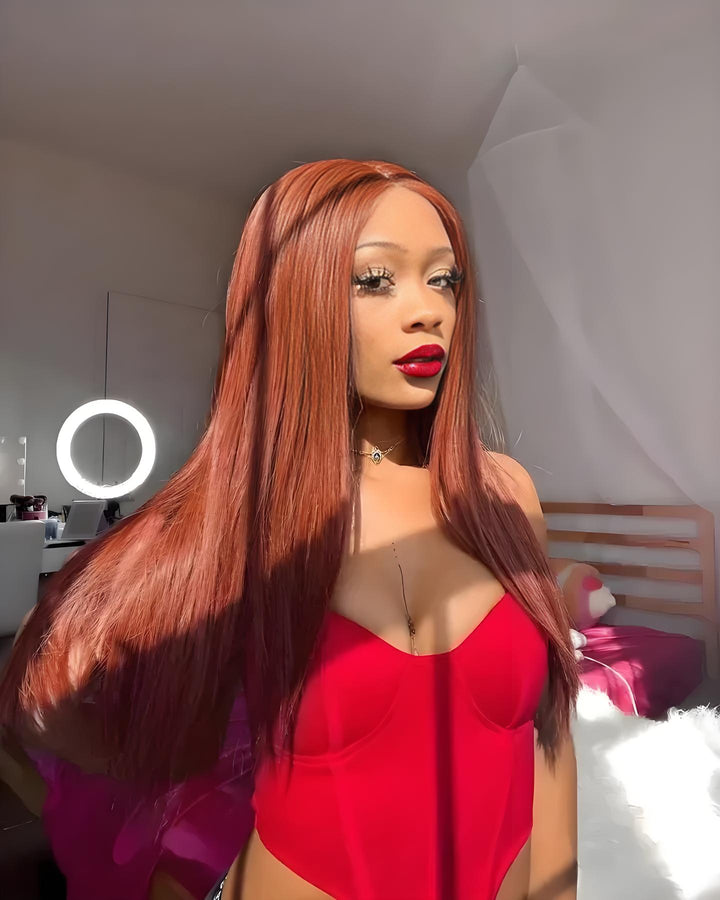 Woman wearing EuxmeHair reddish brown wig in natural light, showing long silky strands and defined middle part.