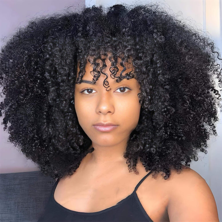Model wearing Afro curly V Part wig in natural color, showcasing large voluminous curls with natural texture.