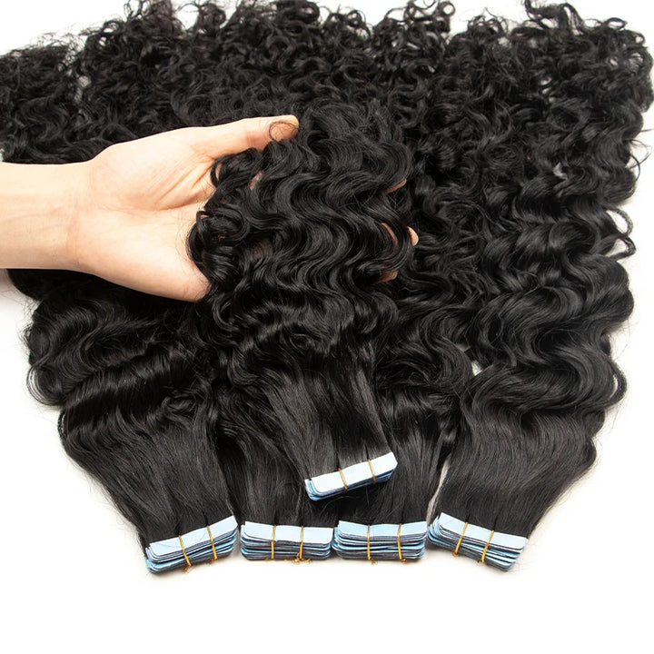 Length measurement of natural color water wave tape in hair extensions using a ruler, showing curl stretch.