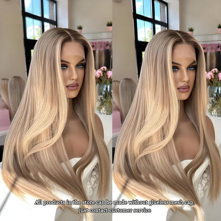 Long straight warm blonde wig displayed on a mannequin in a salon, featuring subtle brown roots and golden tones in natural daylight.